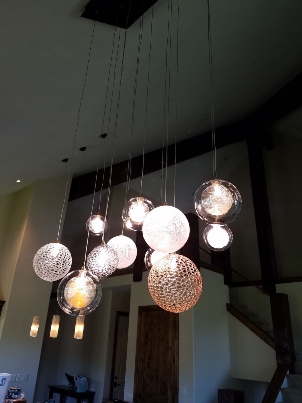 Modern pendant lighting design featuring spherical glass orbs in a stylish interior.